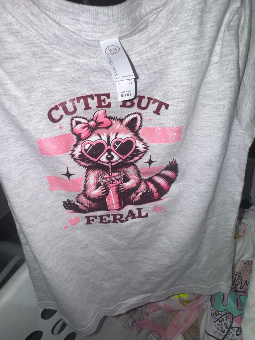 Rabbit Skins Light Heather Gray Tee with Pink Raccoon Graphic
